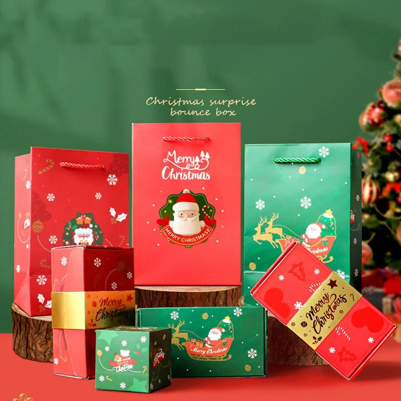 Holiday gift bag and box collection with Santa prints arranged in a seasonal Christmas display