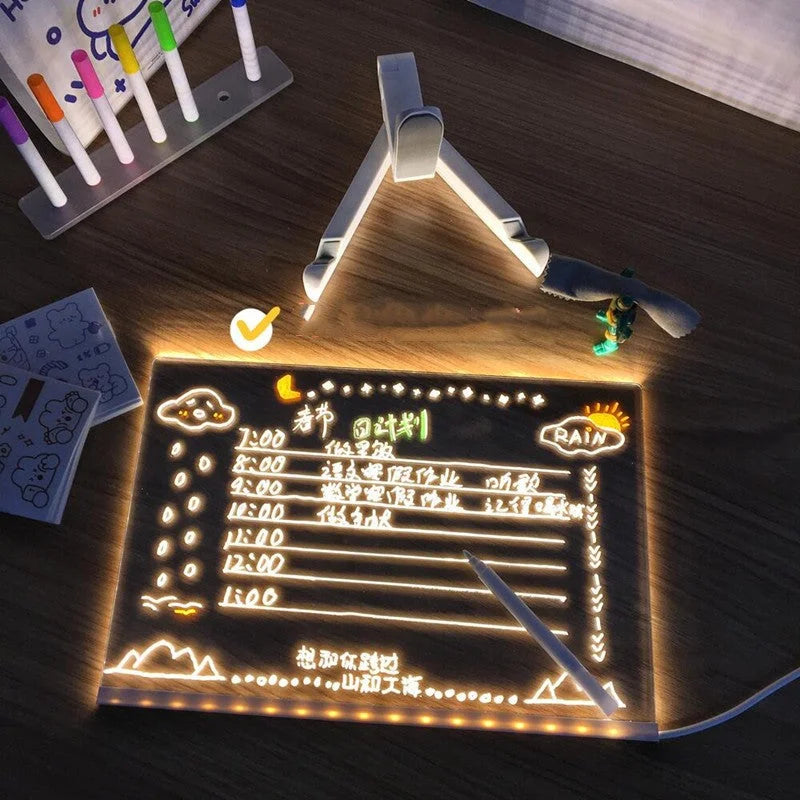 Illuminated acrylic writing board used flat on a desk for a glowing daily schedule layout.