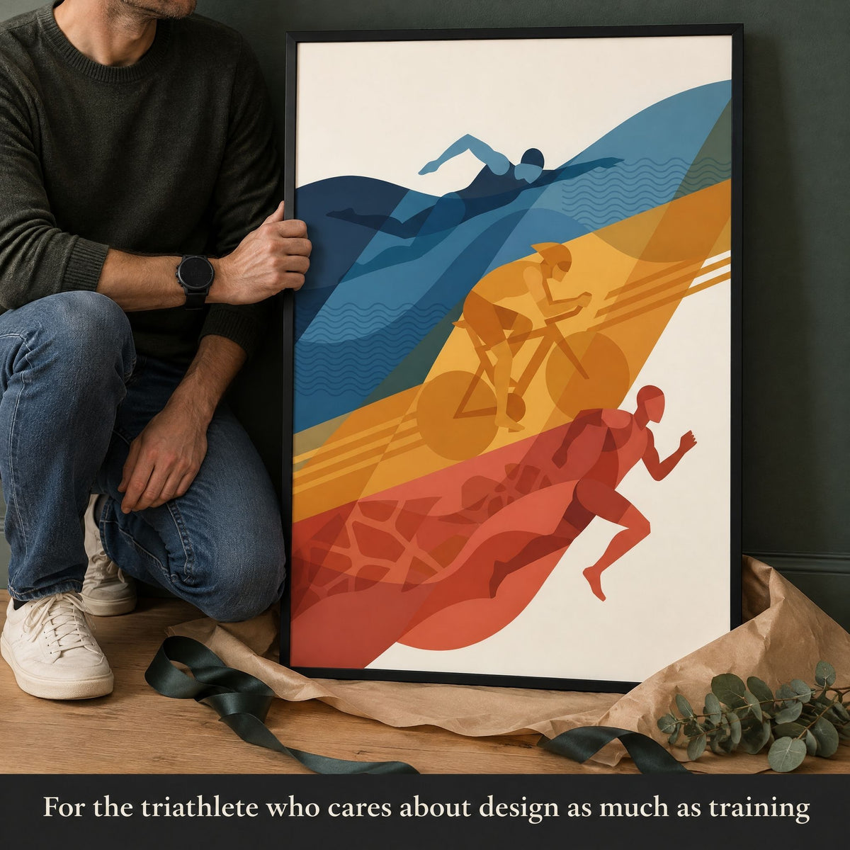 Just-unwrapped triathlon art print propped against a wall, kraft paper peeled at its base