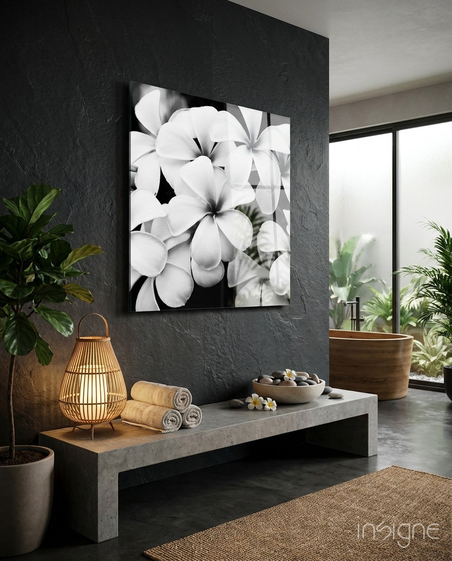 Black and white flowers glass wall art on living room wall