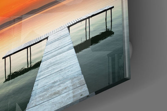 Orange sunset lake pier glossy tempered glass edge close-up