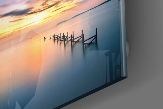 Close-up of the glossy glass edge on the calm sea jetty posts at sunset print