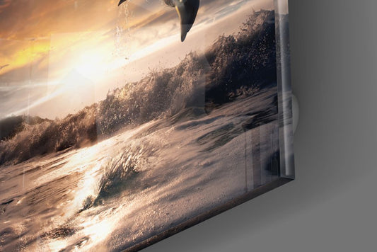 Glossy edge close-up of the dolphin glass wall art showing golden surf and sky