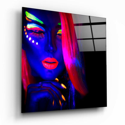Women's portrait glass wall art hanging on a wall