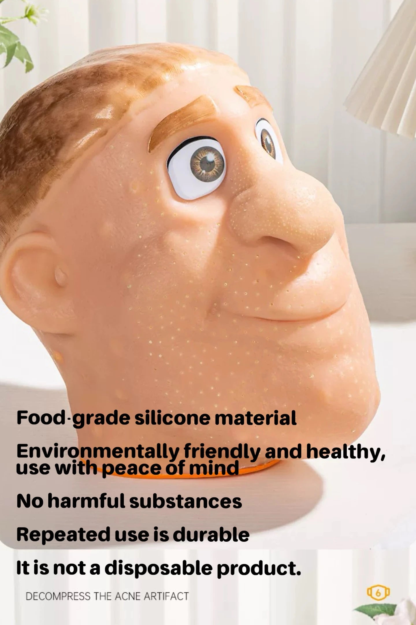 Large silicone face mask with text about material properties of pimple popping fidget toy