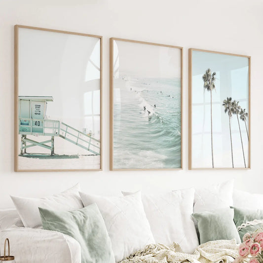 Set of 3 light blue California coastal prints with a lifeguard tower, surfers, and palms
