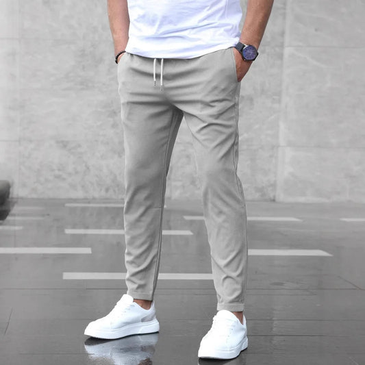 Light Gray men’s slim-fit casual pants displayed in a relaxed standing pose