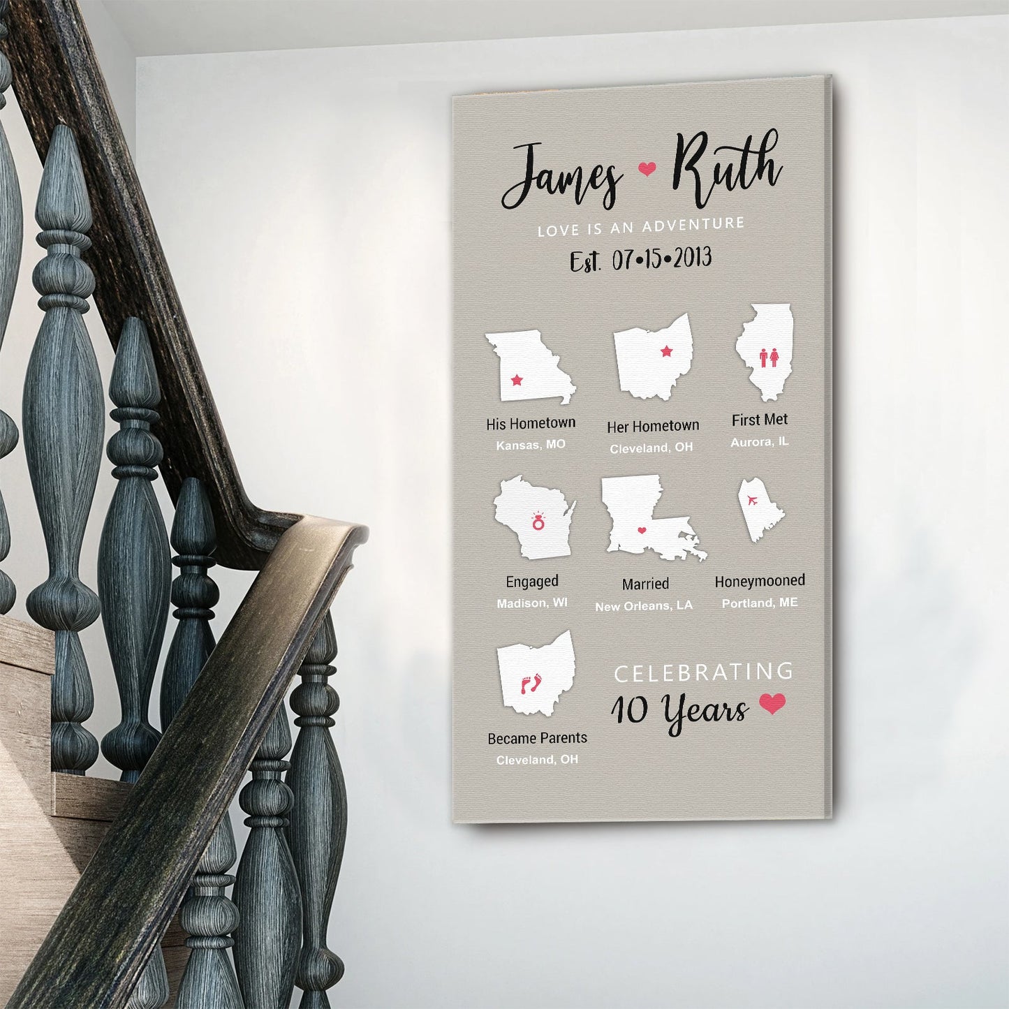 Love Is an Adventure canvas wall art in a bedroom