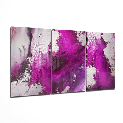 Fuchsia floral glass wall art hanging on a wall