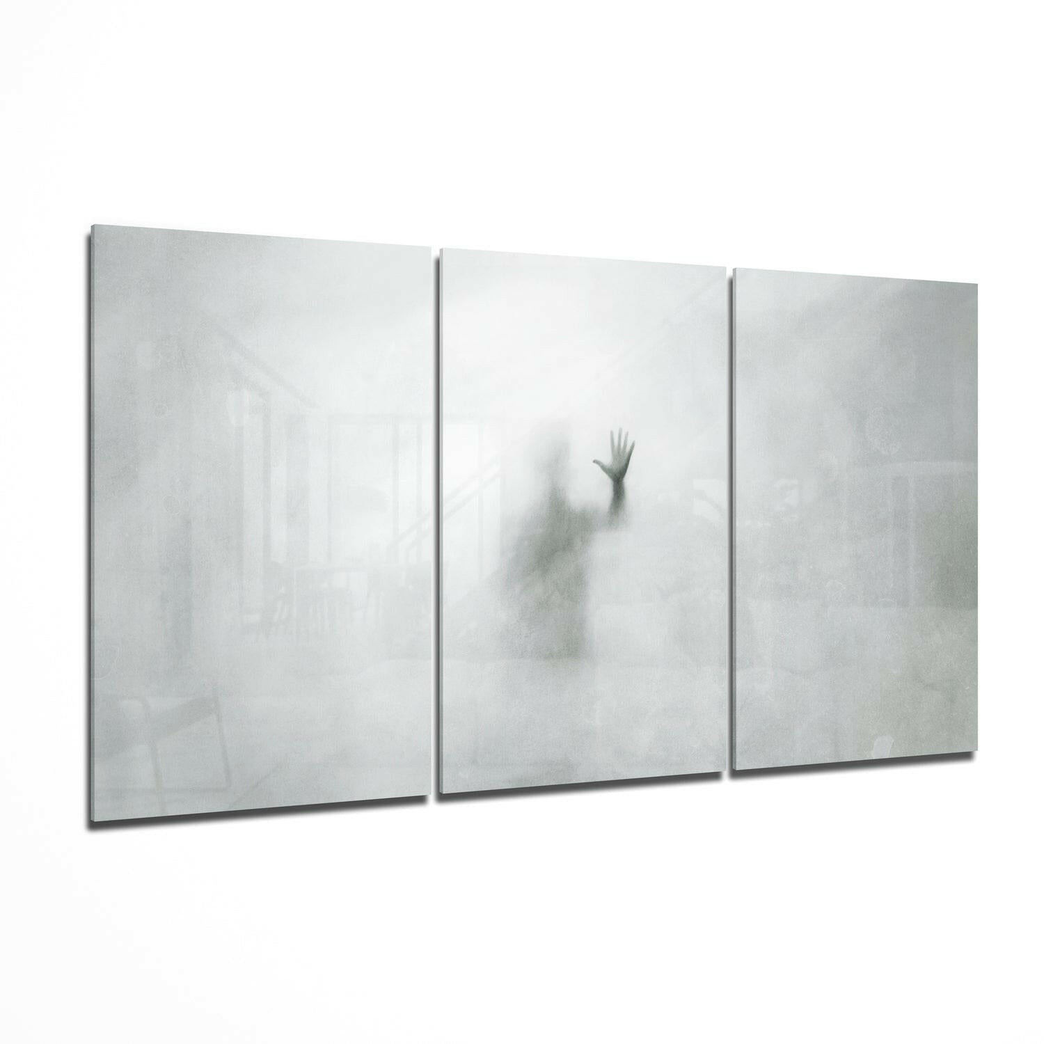 Despair glass wall art print hanging on a wall