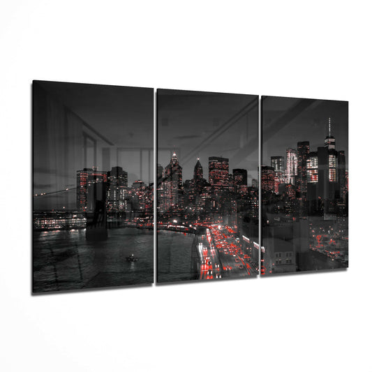 The Lights Of The City glass wall art displayed on a living room wall