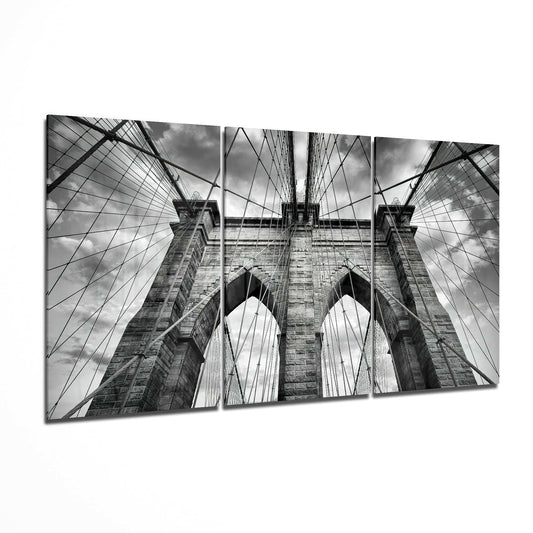 Brooklyn Bridge glass wall art displayed on a living room wall