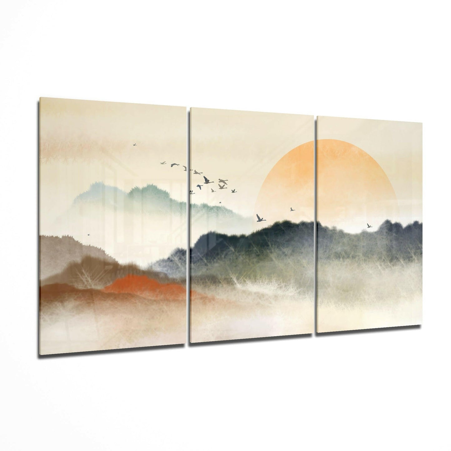 Sunset glass wall art displayed on a living room wall