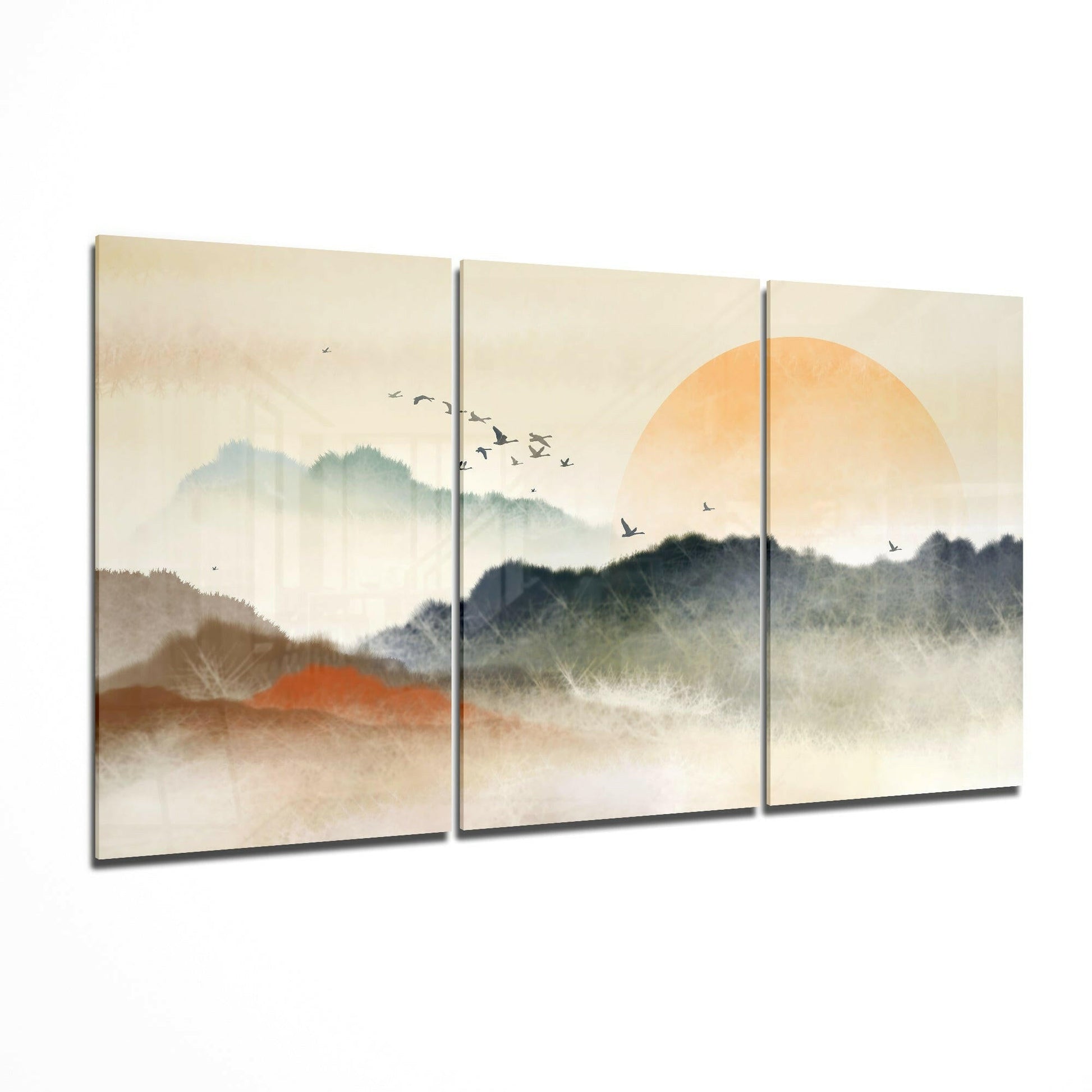 Sunset glass wall art displayed on a living room wall