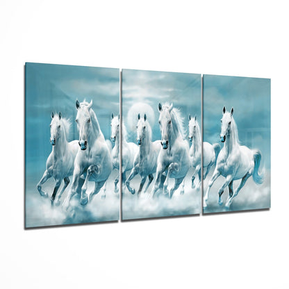 Herd of running horses across a three-panel glass wall art set on high-gloss tempered glass