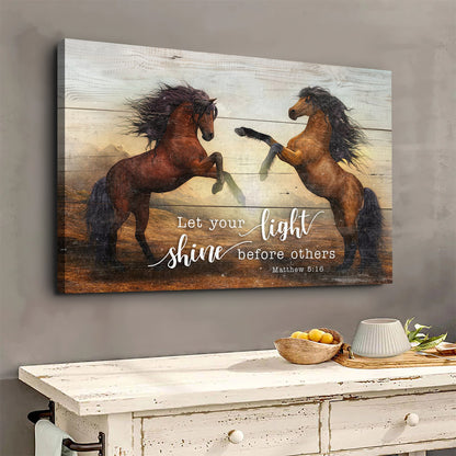 Canvas of two rearing brown horses face to face with Let your light shine before others, Matthew 5:16, above a white cabinet