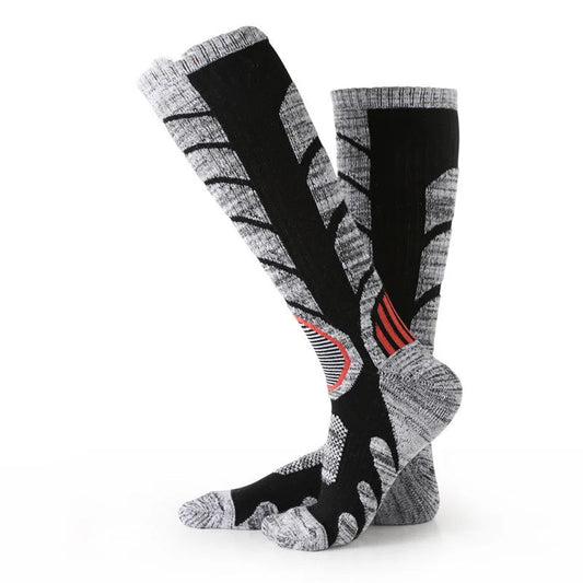 Mid length ski socks in black and gray with compression zones for sports performance