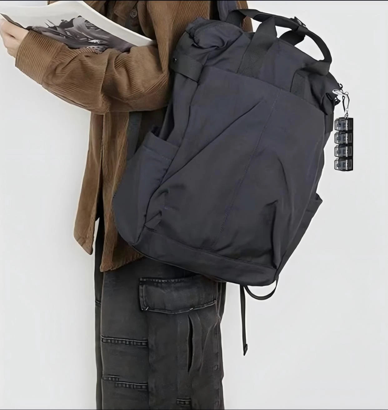 Mini keyboard keychain attached to backpack