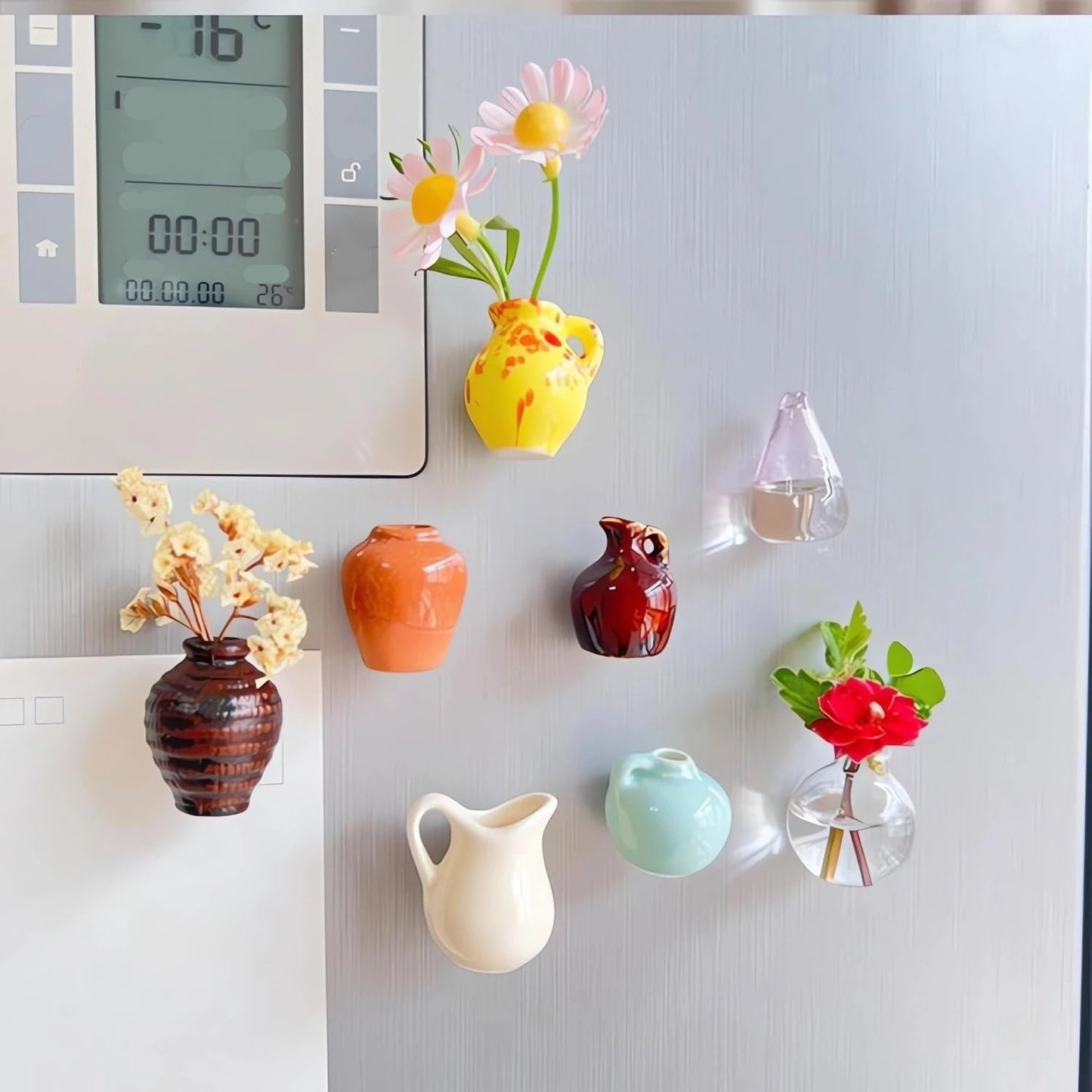 Mini vase fridge magnets in various colors holding decorative flowers