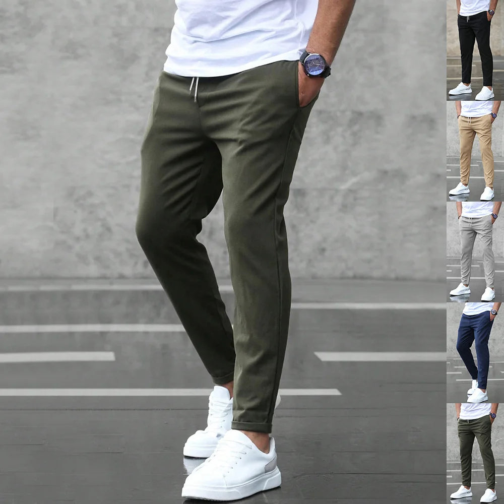 Multi-color lineup of men’s slim-fit stretch pants including Black, Gray, Khaki, Navy Blue, and Army Green