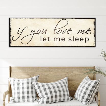 Let me sleep script canvas sign above a wooden bench with gingham pillows