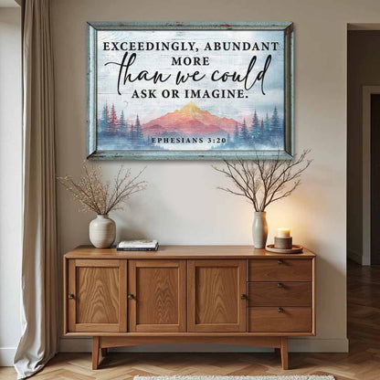 Canvas sign with Exceedingly, Abundant More than we could Ask or Imagine, Ephesians 3:20, over a pink mountain and pines
