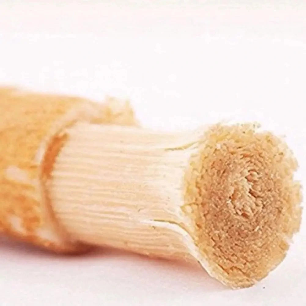 Natural wooden miswak stick showing bristle texture for organic oral care cleaning
