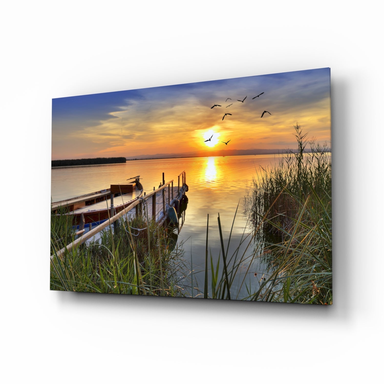 Fishing dock sunset glass wall art in warm orange tones