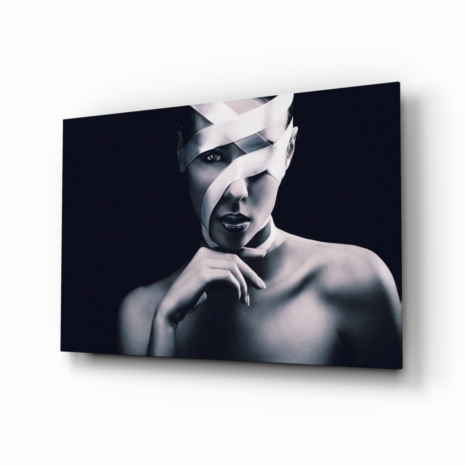 Ribbon-bound portrait glass wall art in black and white