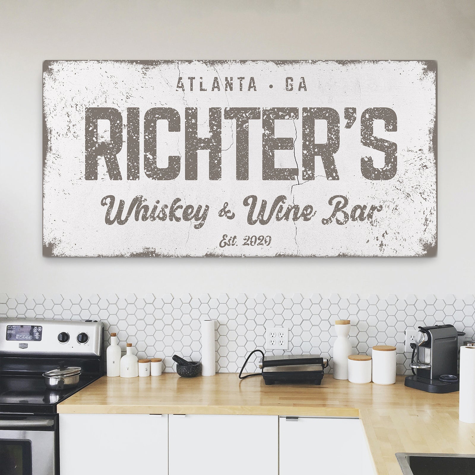 Whiskey and Wine bar canvas wall art above a home bar cart