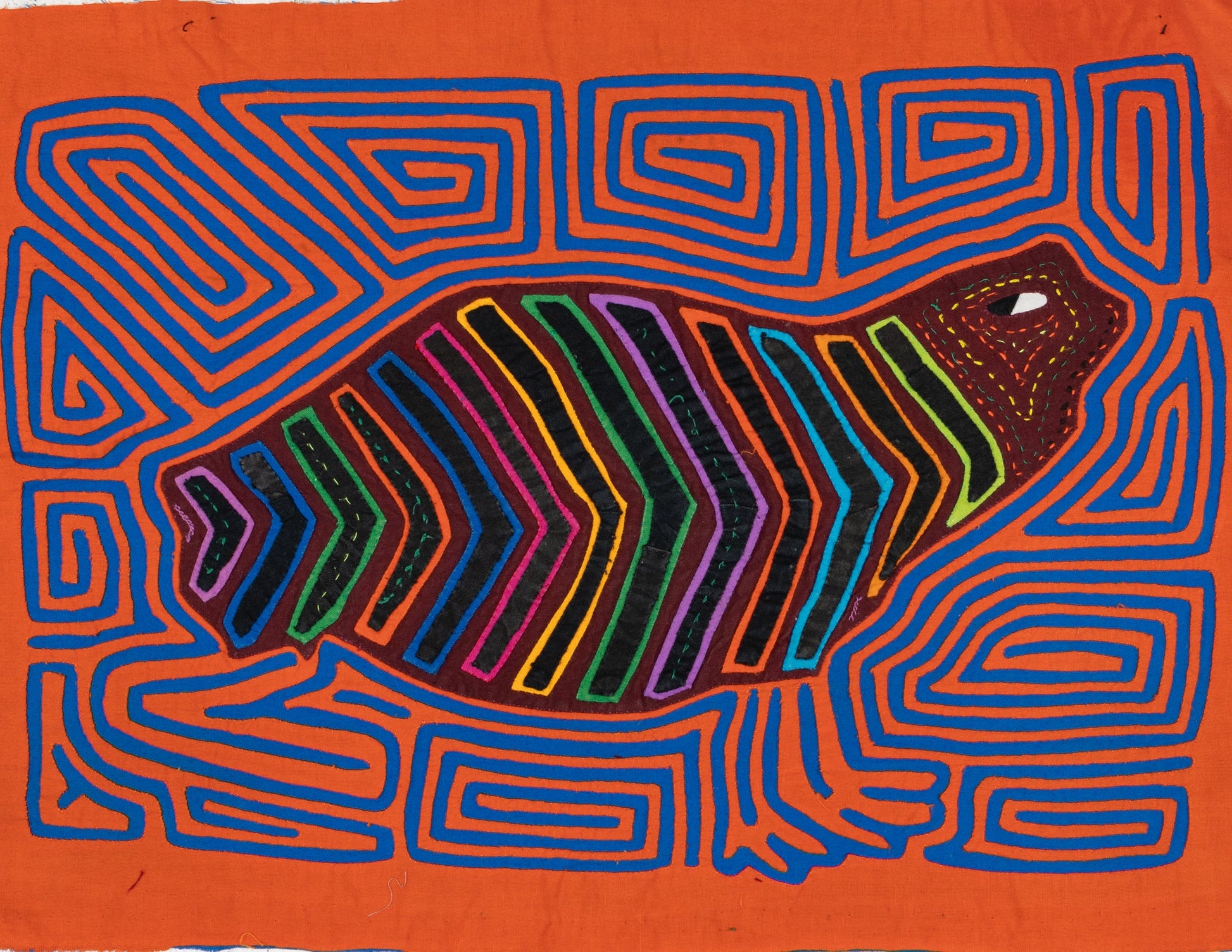 Hand-stitched Panama mola tapestry of a rainbow beluga whale, colorful folk-art fabric wall hanging