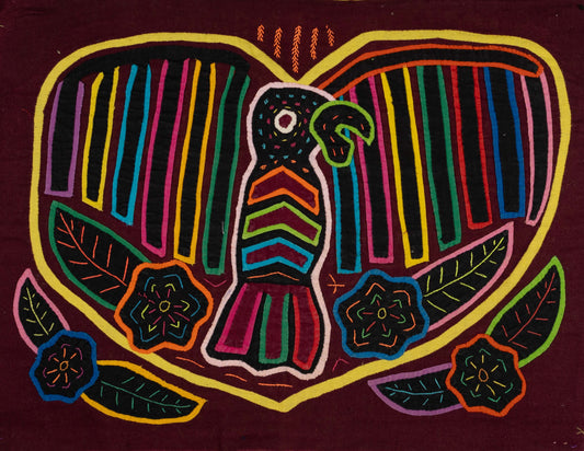 Hand-stitched Panama mola tapestry of a bird carrying a rainbow heart, colorful folk-art fabric wall hanging