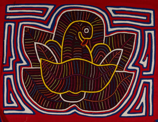 Hand-stitched Panama mola tapestry of a red, white and blue bird in a flower, colorful folk-art fabric wall hanging