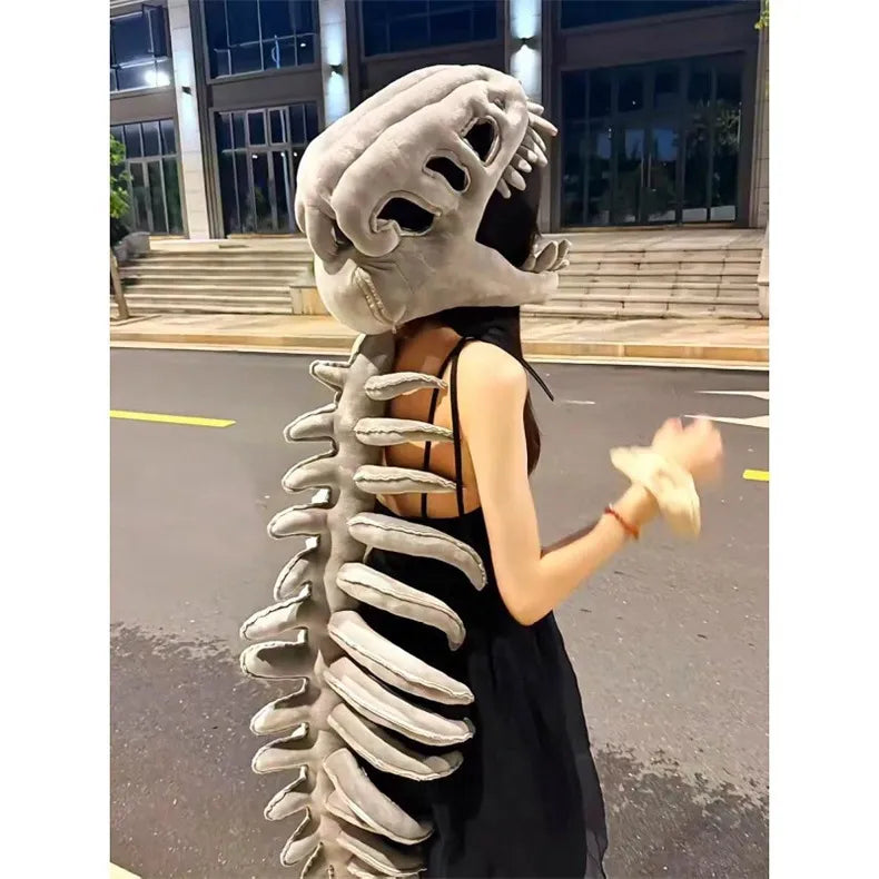 Person wearing dinosaur backpack toy skeleton costume grey plush T-Rex skull