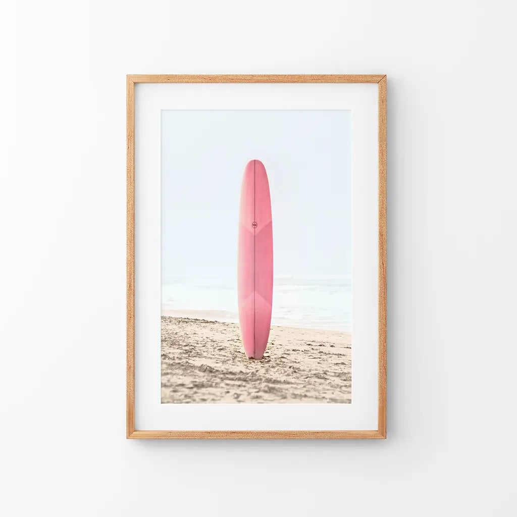 Pink surfboard on sandy beach California coastal wall art print