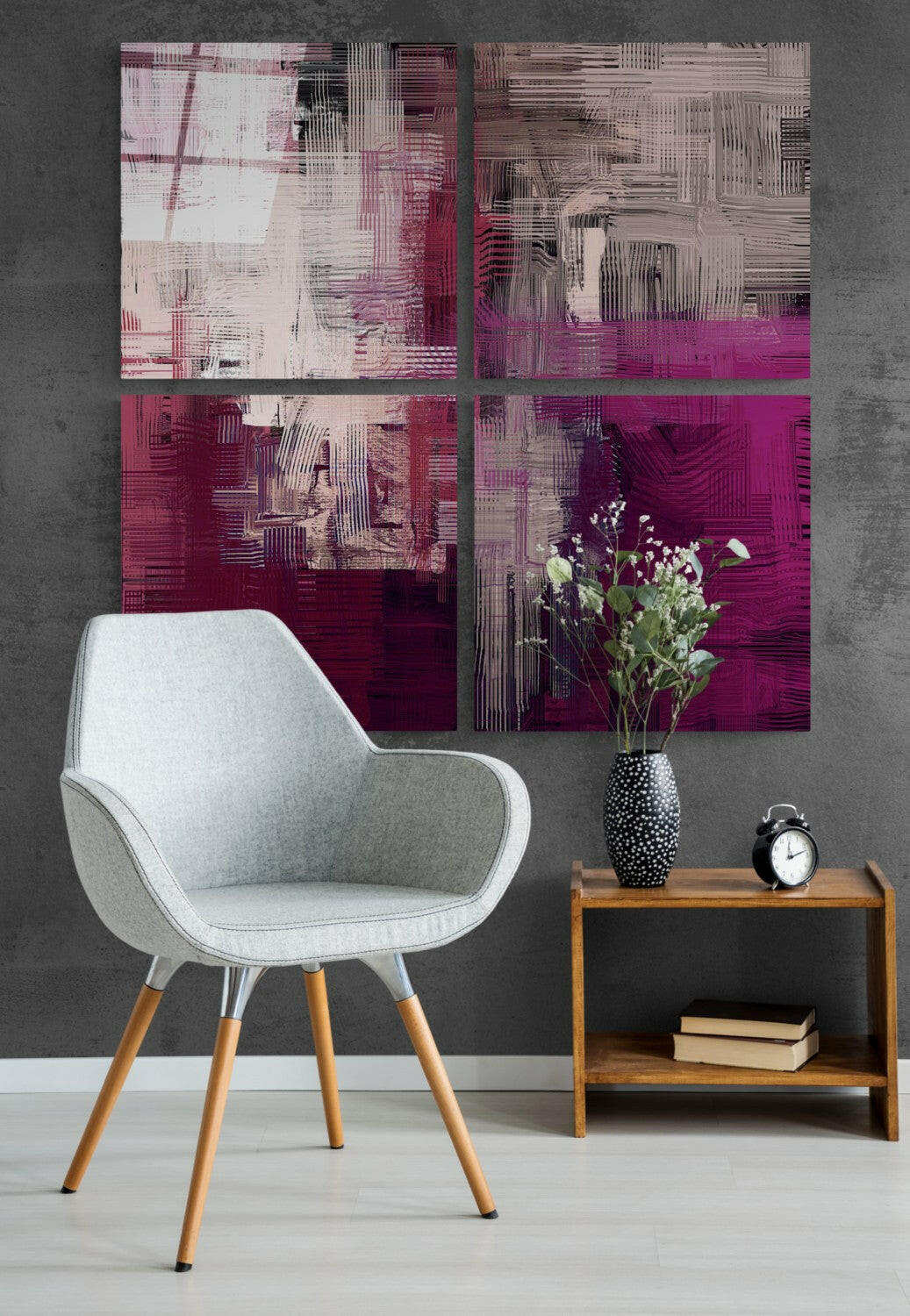 Magenta blush glass wall art on a charcoal wall above a white armchair and a wood side table