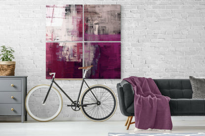 Magenta and blush abstract 4-panel glass wall art on a white brick wall above a green sofa and a bicycle