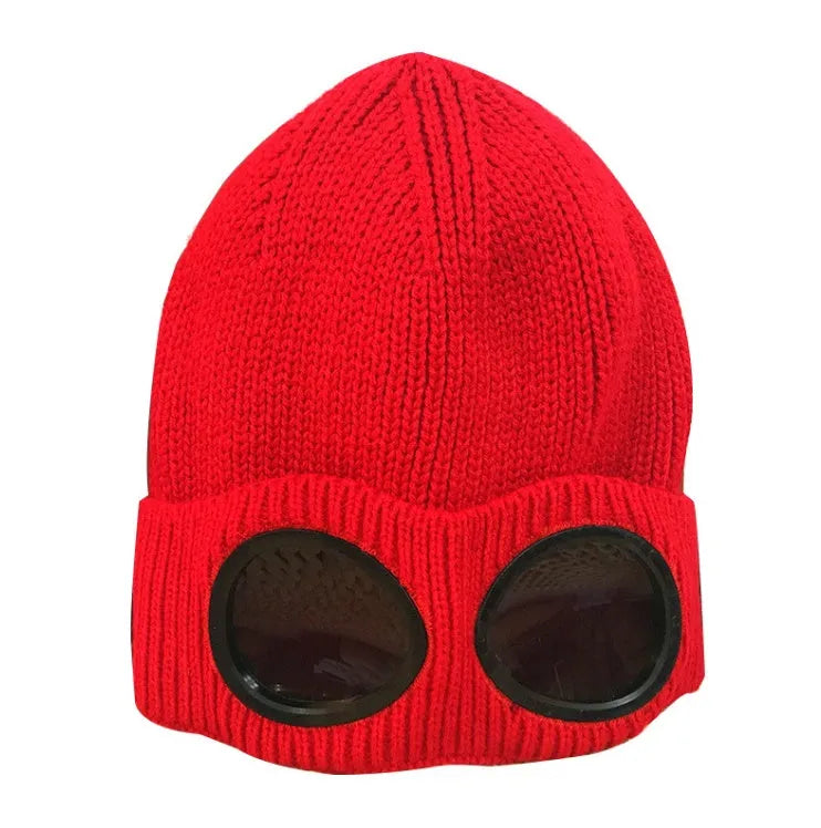 Red knitted wool beanie with goggle lenses, front view