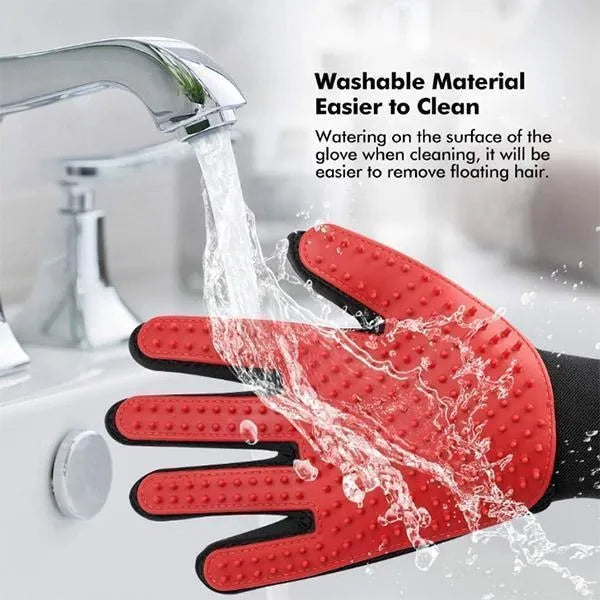 Red pet grooming glove with black accents being rinsed under running water, with text about washable material.