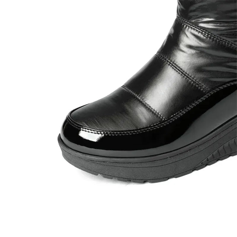 Close-up of patent leather toe and TPR rubber outsole with non-slip tread pattern