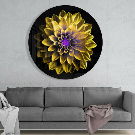 Yellow dahlia round glass wall art above a gray sofa with white and mauve throws