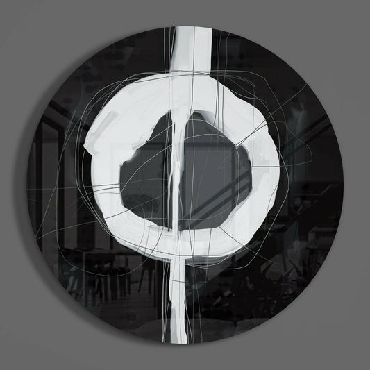 Black and white enso circle round glass wall art on a plain gray wall