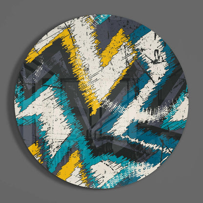 Zigzag abstract round glass wall art on a gray wall, showing the glossy tempered glass face