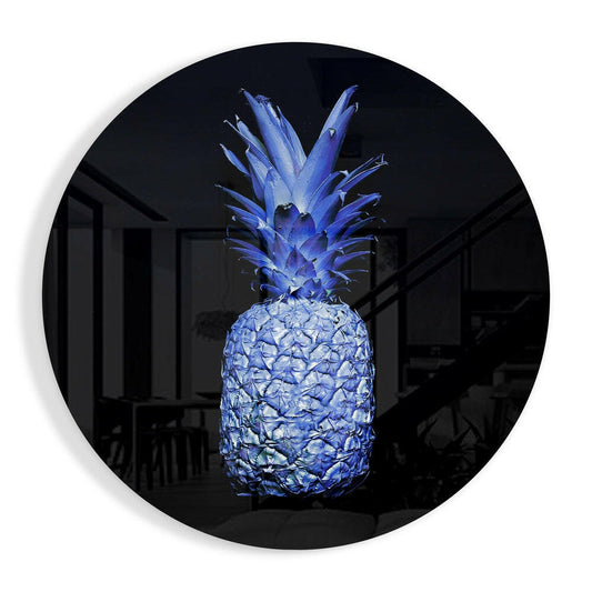 Electric blue pineapple with a spiky crown on a deep black ground, round glass wall art