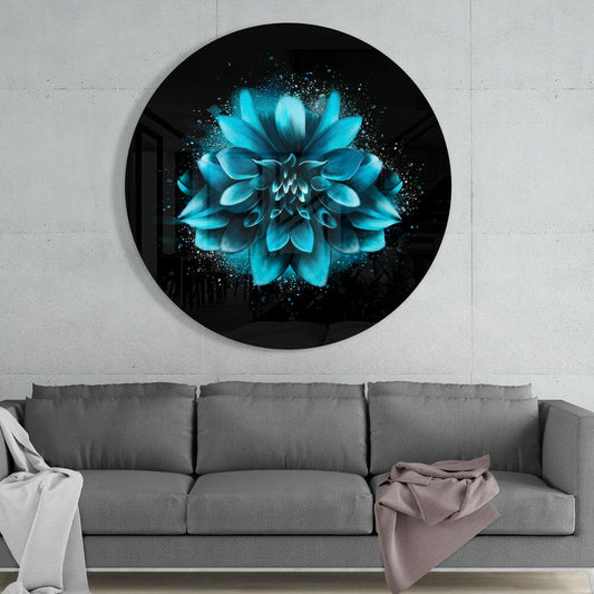 Turquoise dahlia round glass wall art above a gray sofa with white and pink throws