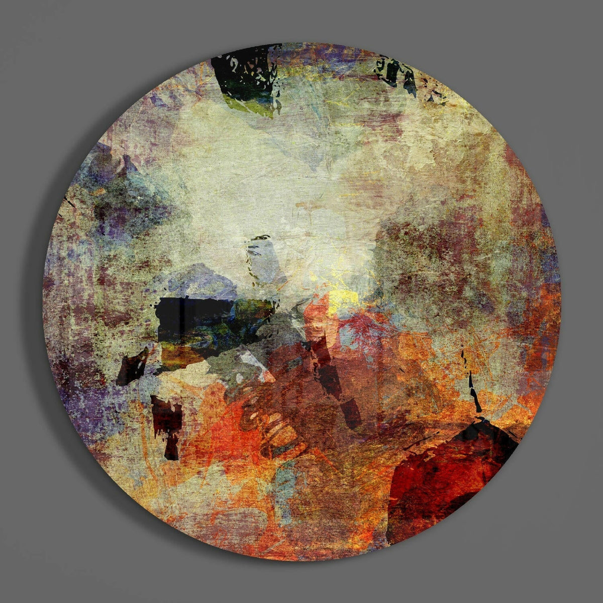 Rustic earth grunge abstract round glass wall art on a plain gray wall