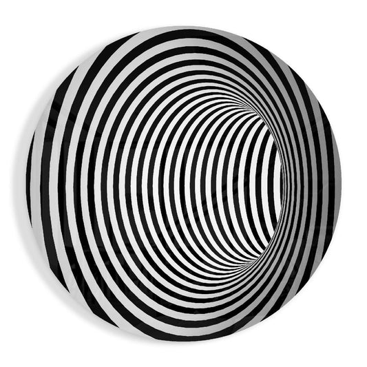 Round glass disc with black and white rings forming a spiral tunnel optical illusion