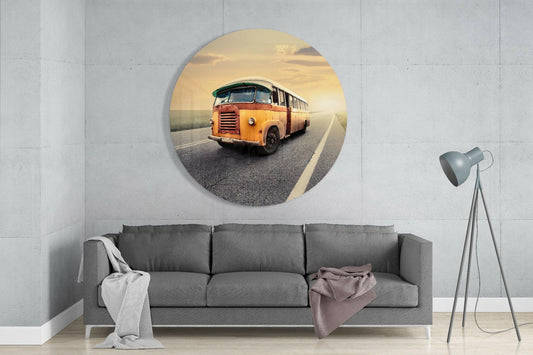 Vintage yellow bus round glass wall art above a gray sofa next to a floor lamp