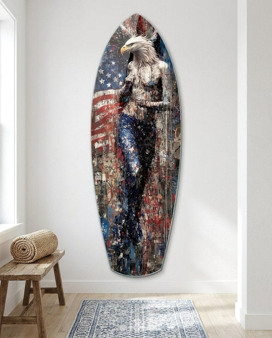 Eagle head figure surfboard glass wall art on a white wall beside a wooden stool and a blue patterned rug
