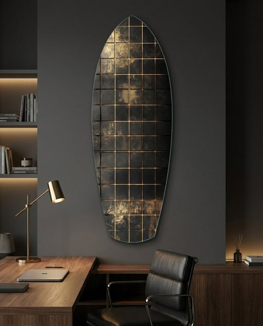 Surfboard glass wall art in a dark home office above a wooden desk with a brass lamp and a leather chair